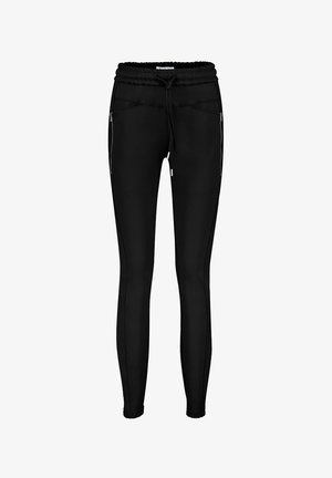 Sorte tapered joggers med elastisk talje og snøre, der har to lynlåslommer foran og kontrasterende sidesømmer. Strækstof.