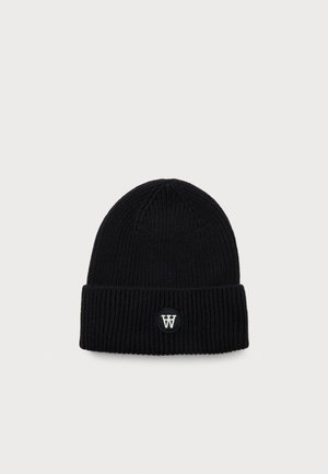 Black ribbed knit beanie with folded cuff and small circular patch featuring white overlapping "W" letters on front center.