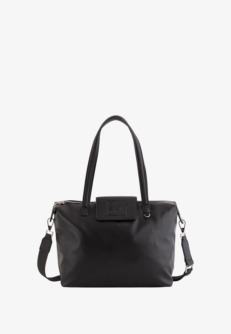 Sac fourre-tout en cuir noir avec double poignées, bandoulière amovible, fermeture à glissière et un rabat avant embossé avec le mot "FRIENDLY."