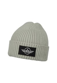 Light gray knitted beanie with a ribbed texture. Features a black patch with a white star and wing graphic. Folded cuff at the brim.