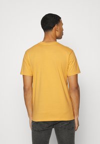 Santa Cruz FLIER HAND  UNISEX - T-shirt estampada - yellow