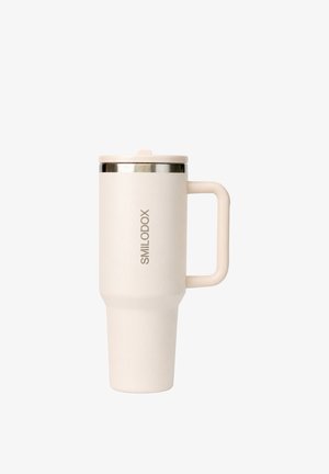 Rejsekrus i cremefarve med håndtag, låg og "SMILODOX" branding på siden.