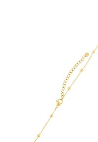 Bracciale in oro con perline rotonde, dotato di chiusura a gancio e catena di estensione regolabile per la personalizzazione della misura.