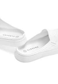 White slip-on shoes with a textured upper and a rubber sole. Features the brand name "ELBSAND" on the insole. Simple design, no embellishments.