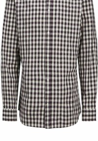 Camicia a maniche lunghe con bottoni, caratterizzata da un motivo a quadri bianco e viola scuro. Realizzata in cotone e dotata di taschino sul petto.