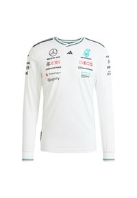 Bijela sportska majica dugih rukava s okruglim izrezom, s crnim i tirkiznim detaljima, te brojnim logotipima sponzora na prednjoj strani i rukavima.
