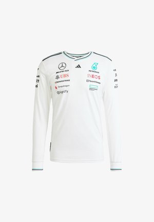 Langärmeliges weißes Sportshirt mit Rundhalsausschnitt, versehen mit schwarzen und türkisfarbenen Akzenten sowie mehreren Sponsorlogos auf der Vorderseite und den Ärmeln.
