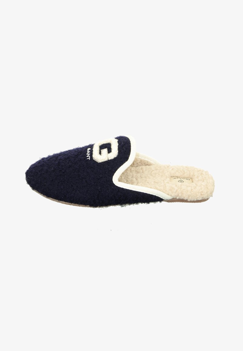 Navy blue slipper with a textured wool upper, cream lining, and a white embroidered logo "GANT" on the front. Flat sole with minimal detailing.