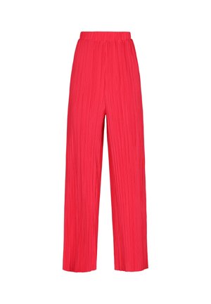 Krepové široké nohavice v jasne červenej farbe s elastickým pásom a textúrovanou tkaninou. Majú hladký povrch s vertikálnymi pruhmi.