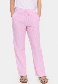 Pink and white striped relaxed fit pants with an elastic waistband and drawstring, featuring side pockets and a straight leg design.