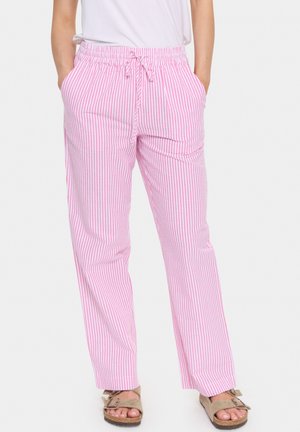 Pink and white striped relaxed fit pants with an elastic waistband and drawstring, featuring side pockets and a straight leg design.