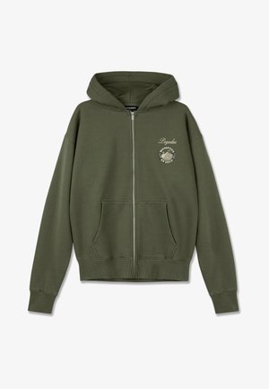 Olive green zip-up hoodie in soft fabric, featuring a front logo print and two side pockets. Ribbed cuffs and hem add texture.