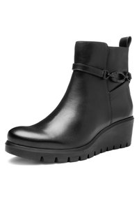 Black leather ankle boot with wedge sole, pull tab at back, and decorative strap with metal ring detail on the side.