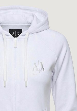 Sweat à capuche blanc zippé avec cordons de serrage et logo "A|X" Armani Exchange sur la poitrine et l'étiquette à l'intérieur du col.