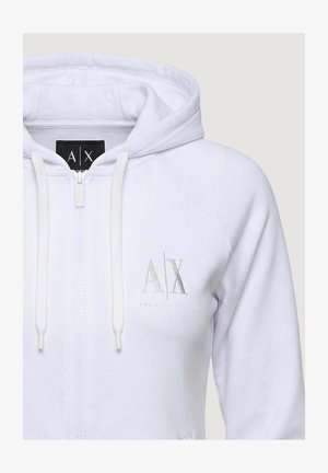Sweat à capuche blanc zippé avec cordons de serrage et logo "A|X" Armani Exchange sur la poitrine et l'étiquette à l'intérieur du col.