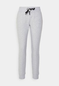 Šedé tepláky s přiléhavým střihem, s černo-bílým páskem na stažení v pase a elastickými lemy na kotnících.