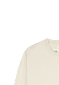 Lichtbeige sweatshirt met een ronde hals, relaxte pasvorm en zichtbare naden. Bevat een klein logo label aan de binnenkant van de halslijn. Zachte textuur.