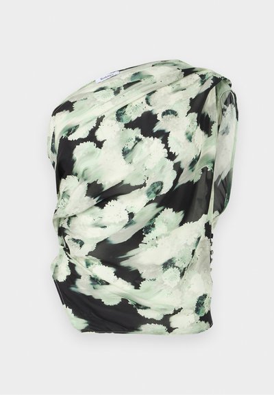 Floral scarf in lightweight fabric, featuring a black background with green and white abstract patterns, draped with soft texture.