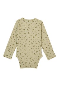 Langsleeve peuterromper in lichtbeige met groene dieren- en loofafdrukken. Beschikt over een ronde halslijn en drukknopen aan de onderkant.