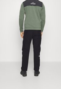 The North Face Ulkohousut - black