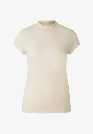 Licht beige T-shirt met korte mouwen en een hoge hals. Gemaakt van zachte stof, met een gladde textuur en een klein logo-accent aan de zoom.