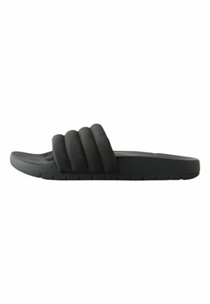 Black slide sandal with thick, padded three-strap upper and flat rubber sole, shown in side profile on white background.