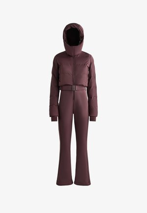 Maroon outerwear set with a puffer jacket featuring a hood and belt, paired with fitted flared pants, both in a smooth, stretchy fabric.