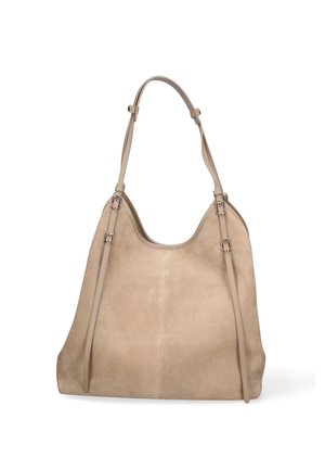 Beige suede shoulder bag with two slim adjustable straps and a curved top opening, standing upright on a white background.