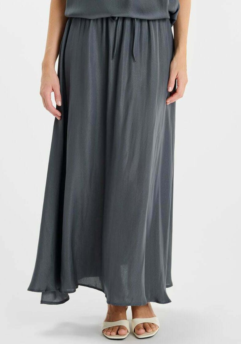 Maxi-rok in donkergrijs, gemaakt van lichtgewicht stof. Voorzien van een elastische tailleband met een trekkoord en een zwierig zoom.