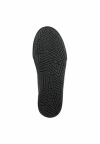 Black rubber shoe sole featuring a textured tread pattern for grip, with a rectangular logo embossed in the center.