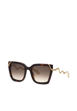 Lunettes de soleil carrées en écaille avec des verres marron dégradés et des branches dorées en forme de serpent qui s’enroulent vers l’extérieur.