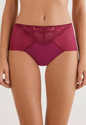 Burgundy lace hipster panties with sheer accent at the waist, floral lace detailing, and smooth fabric extending to the sides.