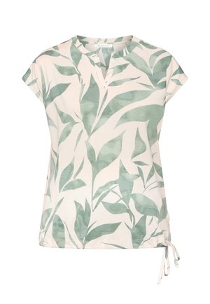 Weiße Bluse mit kurzen Ärmeln, grünen Blattmustern, V-Ausschnitt und seitlicher Bindung am Saum.