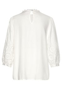 Witte blouse met een geplooide halslijn en een keyhole achterkant. Kenmerkt zich door pofmouwen met geborduurde details en knoopsluitingen.