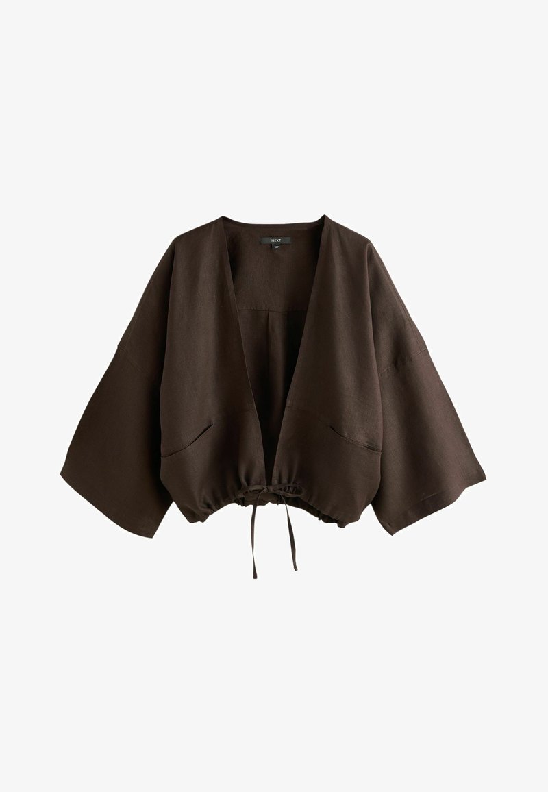 Veste raccourcie marron foncé, ample, avec manches larges, devant ouvert, deux poches latérales et ourlet ajustable par cordon.