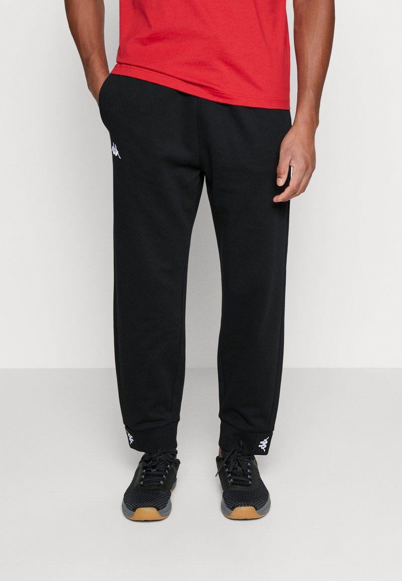Kappa TAPE CUFF PANTS Tracksuit bottoms caviar/black Zalando.co.uk