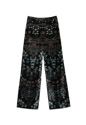 Pantalons en velours noir à jambes larges avec un motif floral et botanique multicolore sur l'ensemble.