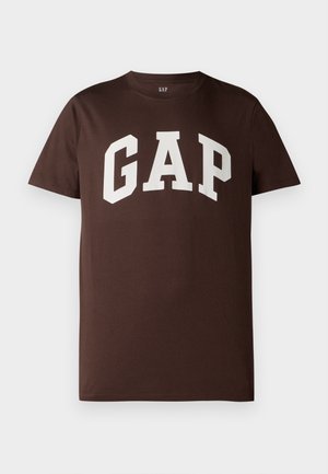 Brown cotton T-shirt featuring a white "GAP" logo in a bold, collegiate font. Short sleeves and a crew neckline. Smooth texture.