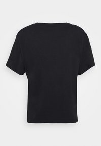 Zwarte T-shirt met korte mouwen van katoen. Kenmerkt zich door een klassieke ronde hals en een losse pasvorm met een gladde, effen textuur.