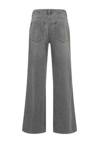 Grau melierte Jeans mit weitem Bein, von hinten gesehen, mit zwei Gesäßtaschen, Gürtelschlaufen und subtilen Verblassungen im Stoff.