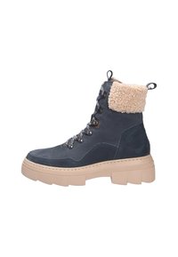 Stivaletti in suede blu scuro con fodera in pelliccia sintetica beige, suola in gomma spessa e occhielli metallici per i lacci. Caratterizzati da una punta rotonda.