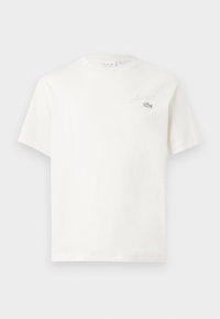 T-shirt en coton blanc à manches courtes, avec un logo brodé subtil et un design minimaliste. Texture douce, col rond.