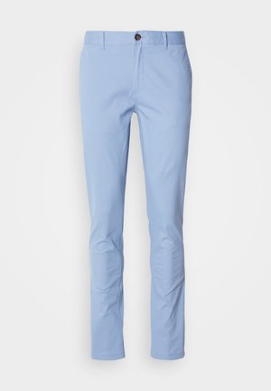 Light blue chinos made of cotton with a slim fit, featuring a single brown button at the waistband and subtle stitching details.