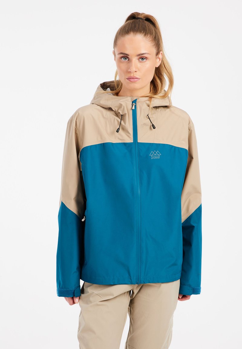 Nepremokavá bunda v odtieni teal a pieskovom, s kapucňou, predným zipsom, nastaviteľnými šnúrkami a logom na hrudi. Obsahuje pohodlný voľný strih.