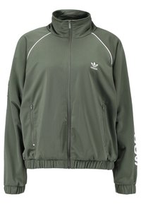 Olivgrön zipjacka i slätt, lätt material. Har en hög krage, elastiska cuffs, två sidofickor och vita detaljer.