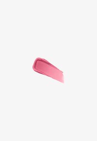Glatt strøk med rosa kremet sminkeprodukt på hvit bakgrunn, som viser tekstur og fargegradient.