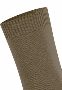 Close-up of a beige ribbed knit sock cuff with a textured, elastic top edge on a plain white background.