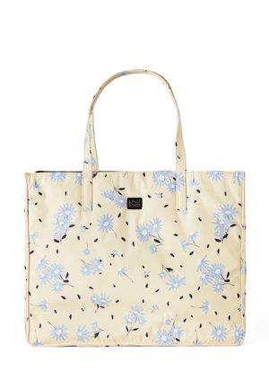 Sac cabas crème avec imprimé floral bleu clair et deux bretelles, avec un petit logo rectangulaire noir au centre avant.