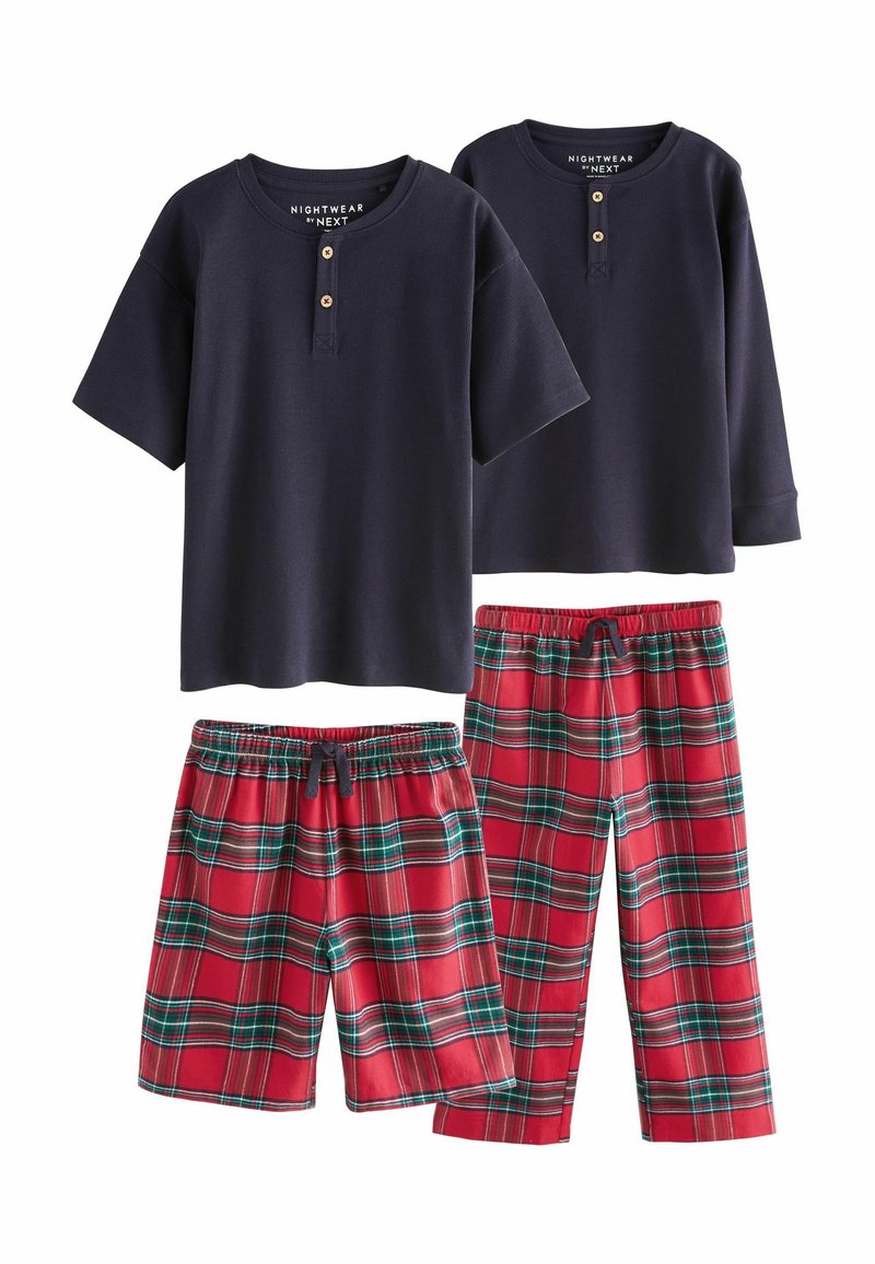 Navy short-sleeve henley shirts with button accents, paired with red plaid pajama shorts and long pants featuring green and black stripes.
