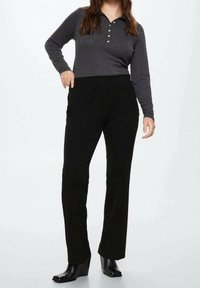 Black, tailored pants with a smooth texture, paired with a long-sleeve, gray ribbed polo shirt featuring a button placket.